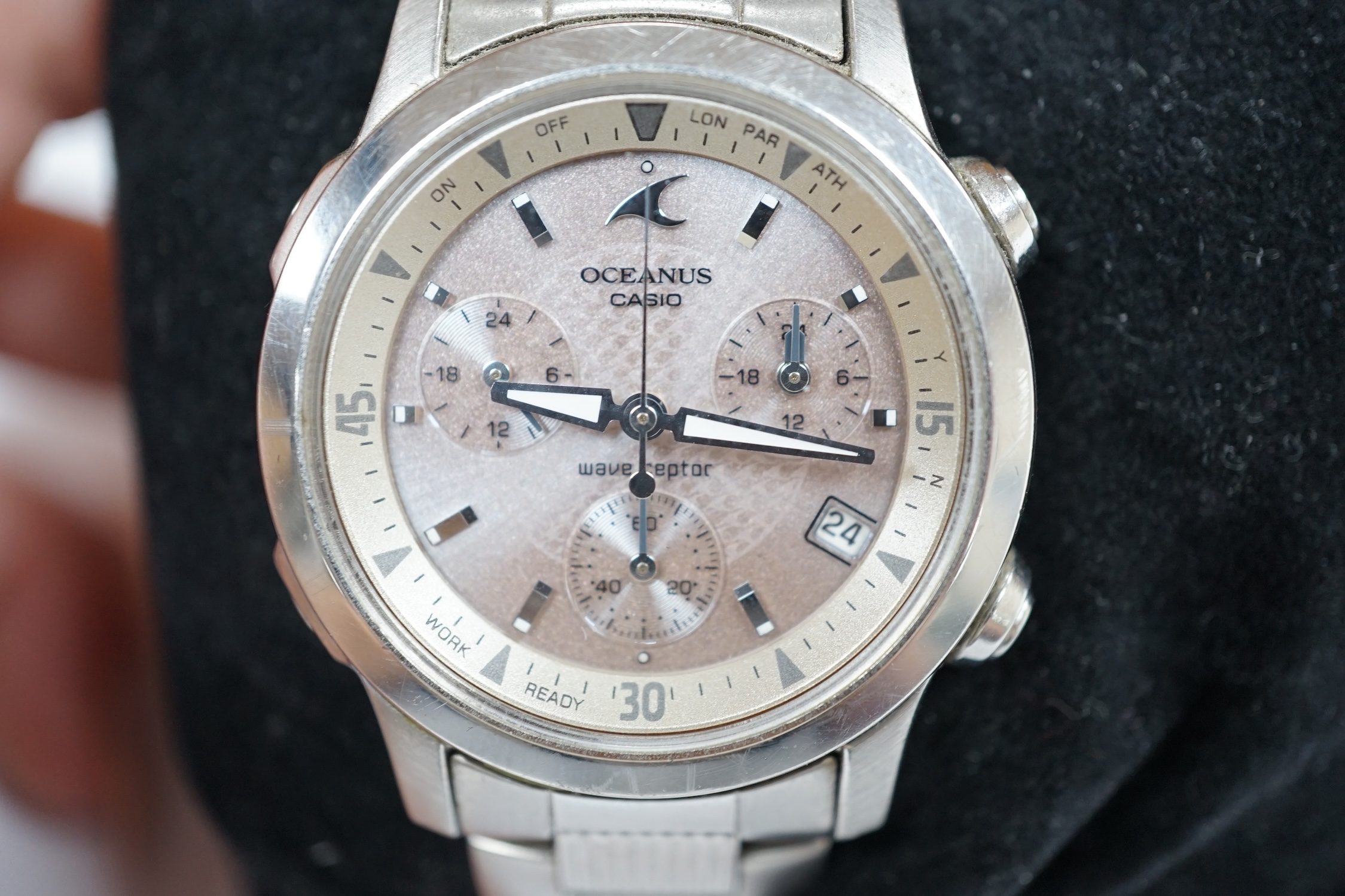 A modern stainless steel Casio Oceanus Wave Ceptor quartz wrist watch, on a Casio stainless steel bracelet, with original box, spare link and warranty pamphlet. Condition - fair to good